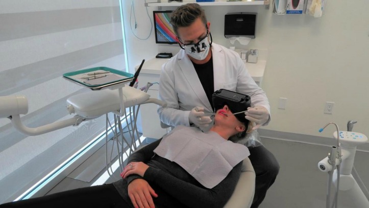 dental-patient-wearing-virtual-reality-goggles-during-visit